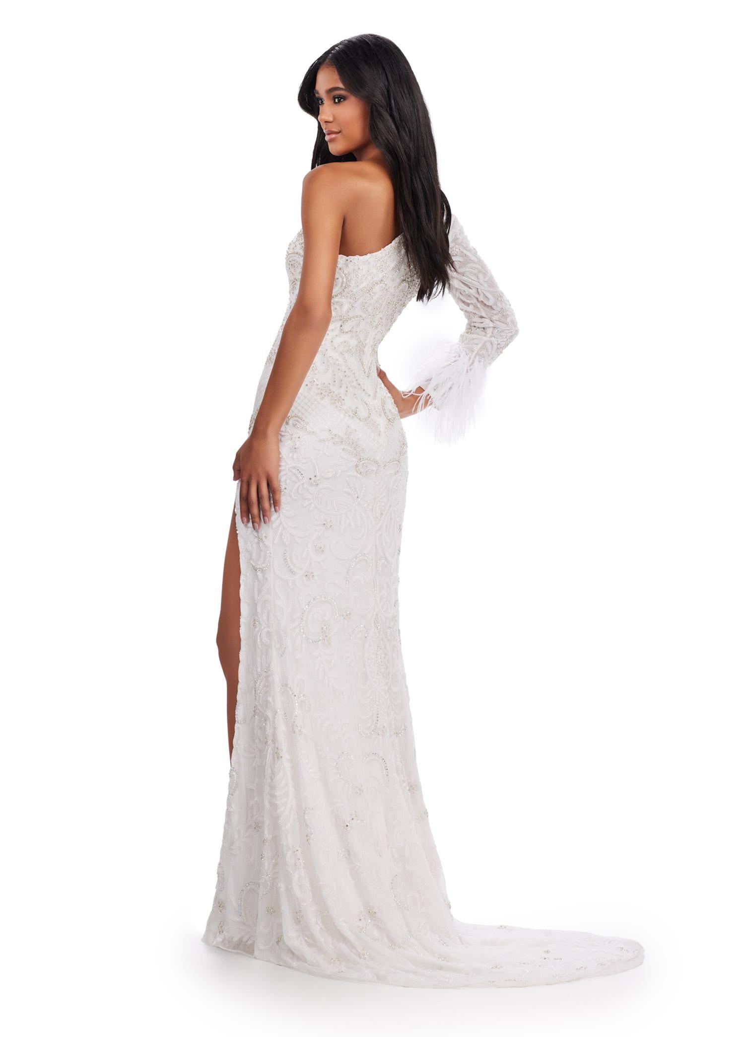 Back view. Ivory ASHLEYlauren 11649 One Shoulder Fully Beaded Gown with Intricate Beading, Side Cut Out, Feather Cuff Detail, Left Leg Slit, and Sweep Train