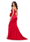 Back view. Red ASHLEYlauren 11752 bold strapless taffeta gown featuring a corset bustier, oversized flower detail at the hip, left leg slit, and elegant sweep train for a show-stopping silhouette.