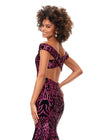 Back view. Ruby Red ASHLEYlauren 11330 elegant off shoulder velvet sequin gown featuring a signature criss-cross back, a fitted silhouette, horsehair hem, and a sweep train for a sophisticated and glamorous look.