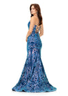 Back view. Turquoise/Royal ASHLEYlauren 11331 stunning velvet sequin gown featuring delicate spaghetti straps, a lace-up back for a perfect fit, intricately placed sequin appliques to complement your curves, and a sweep train for a glamorous and show-stopping entrance.