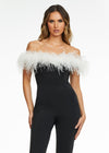 ASHLEYlauren 11100 – A flirty off-shoulder scuba jumpsuit featuring feather details along the neckline and flare pant legs. Perfect for making a stylish statement at your next event.