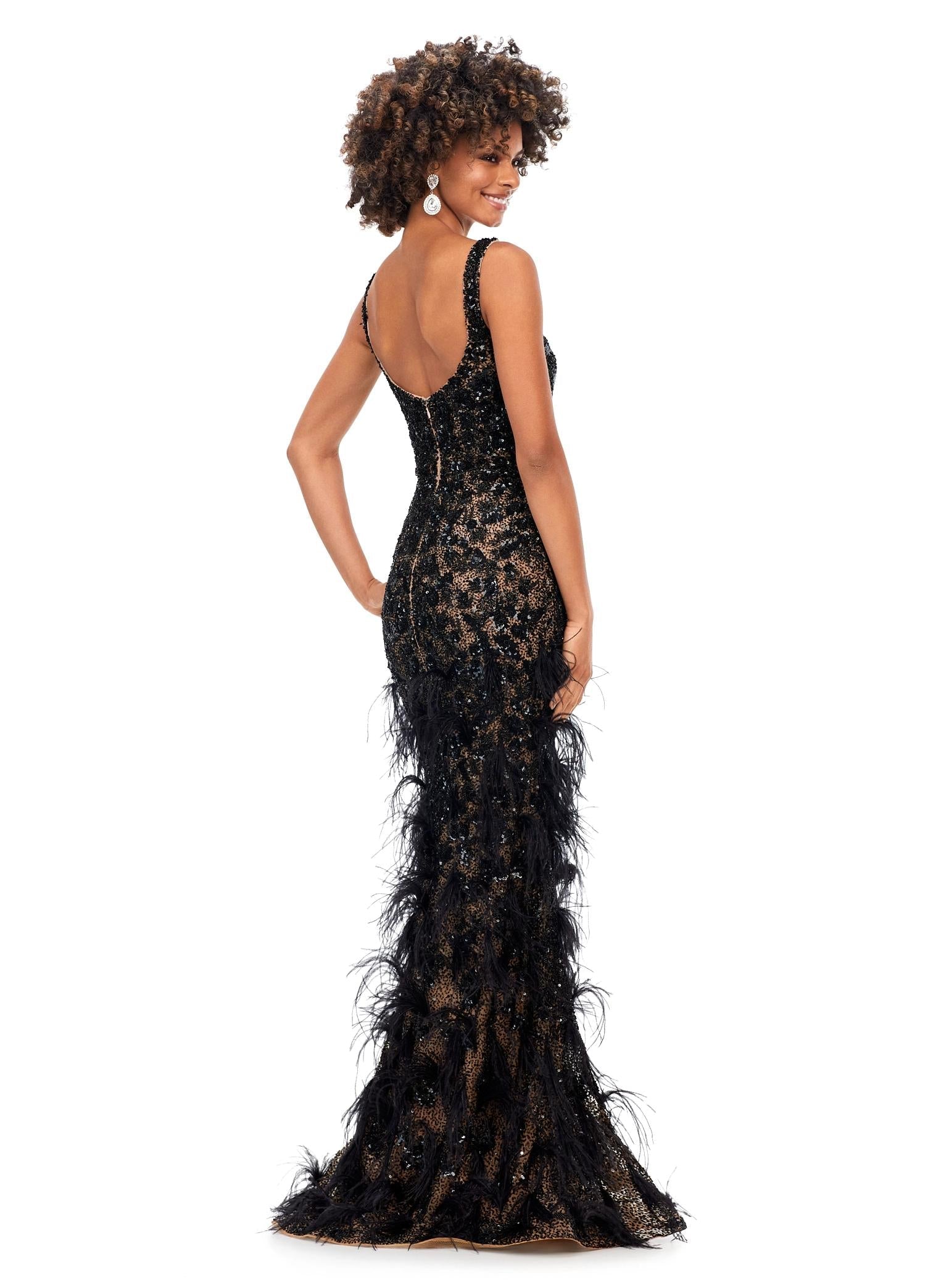Back - Black ASHLEYlauren 11279 fitted gown featuring a deep illusion V-neckline, fully hand-beaded design, and feather accents throughout the skirt.
