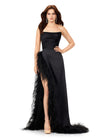 Black ASHLEYlauren 11313 strapless satin gown featuring a ruched bustier, slight A-line skirt, high right leg slit, and cascading feather trim along the hemline.