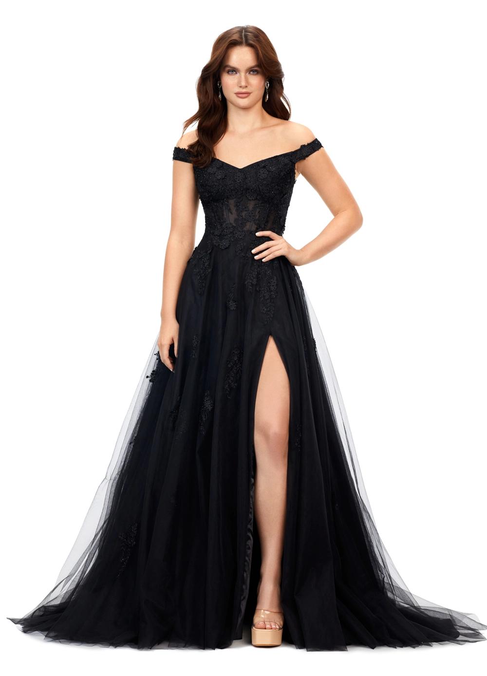 Black ASHLEYlauren 11376 fairytale-inspired off-shoulder gown featuring an illusion corset bodice, delicate 3D lace flower appliques cascading throughout layers of tulle, and a left leg slit for an ethereal and romantic look.