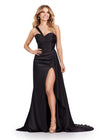 Black ASHLEYlauren 11576 ruched satin gown featuring a Grecian-inspired one shoulder neckline, sweetheart bustier, left leg slit, and a side train for an elegant, flowing finish.