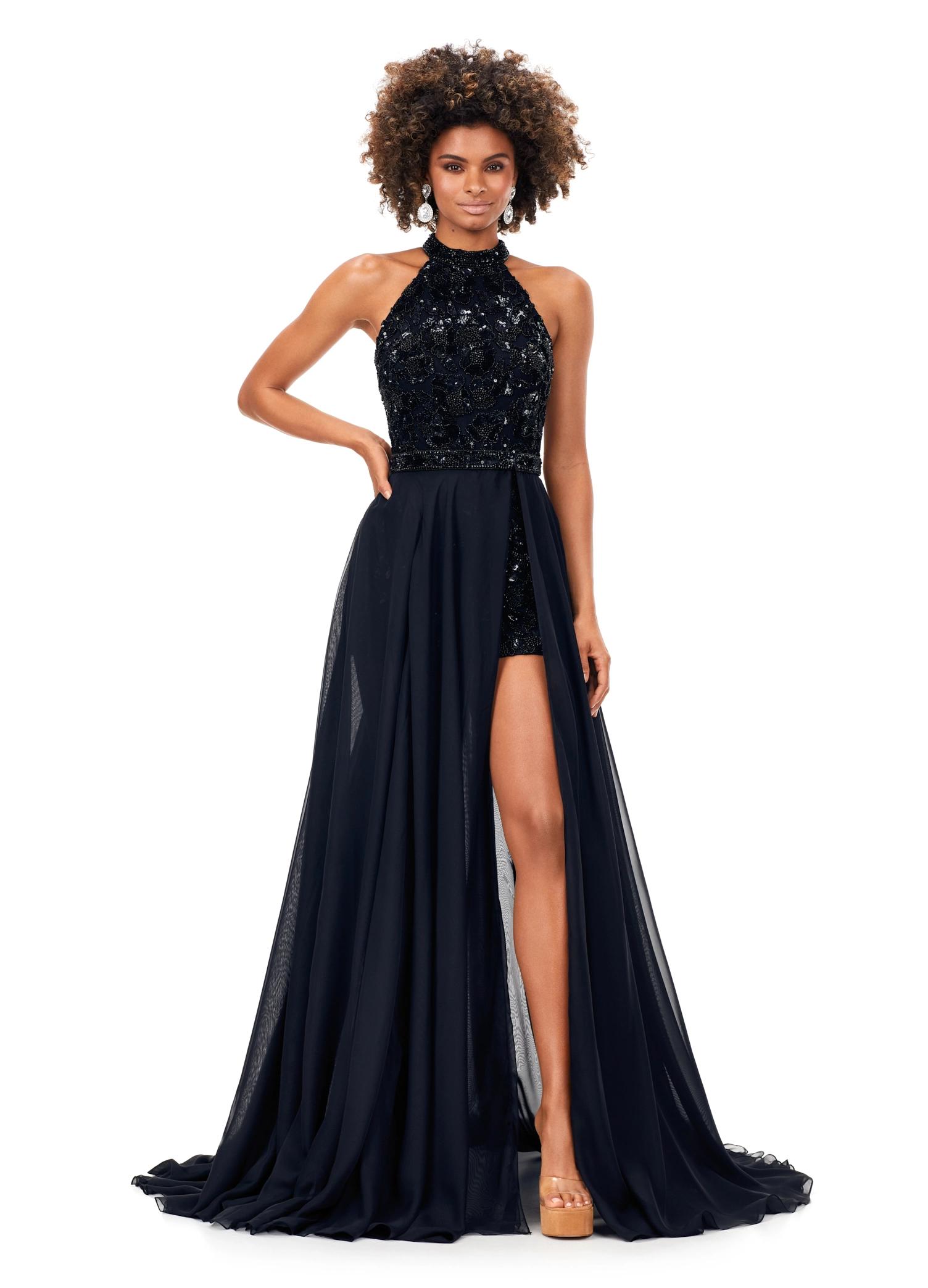 Black ASHLEYlauren 13354 hand-beaded romper featuring an intricate floral motif, halter neckline, beaded belt, and a detachable chiffon overskirt for a glamorous and versatile look.