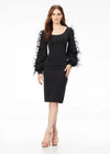 Black ASHLEYlauren 4545 elegant scuba cocktail dress featuring a scoop neckline, bishop sleeves embellished with scattered crystals and feathers, a fitted tea-length skirt, and a full zipper back for a sophisticated finish.