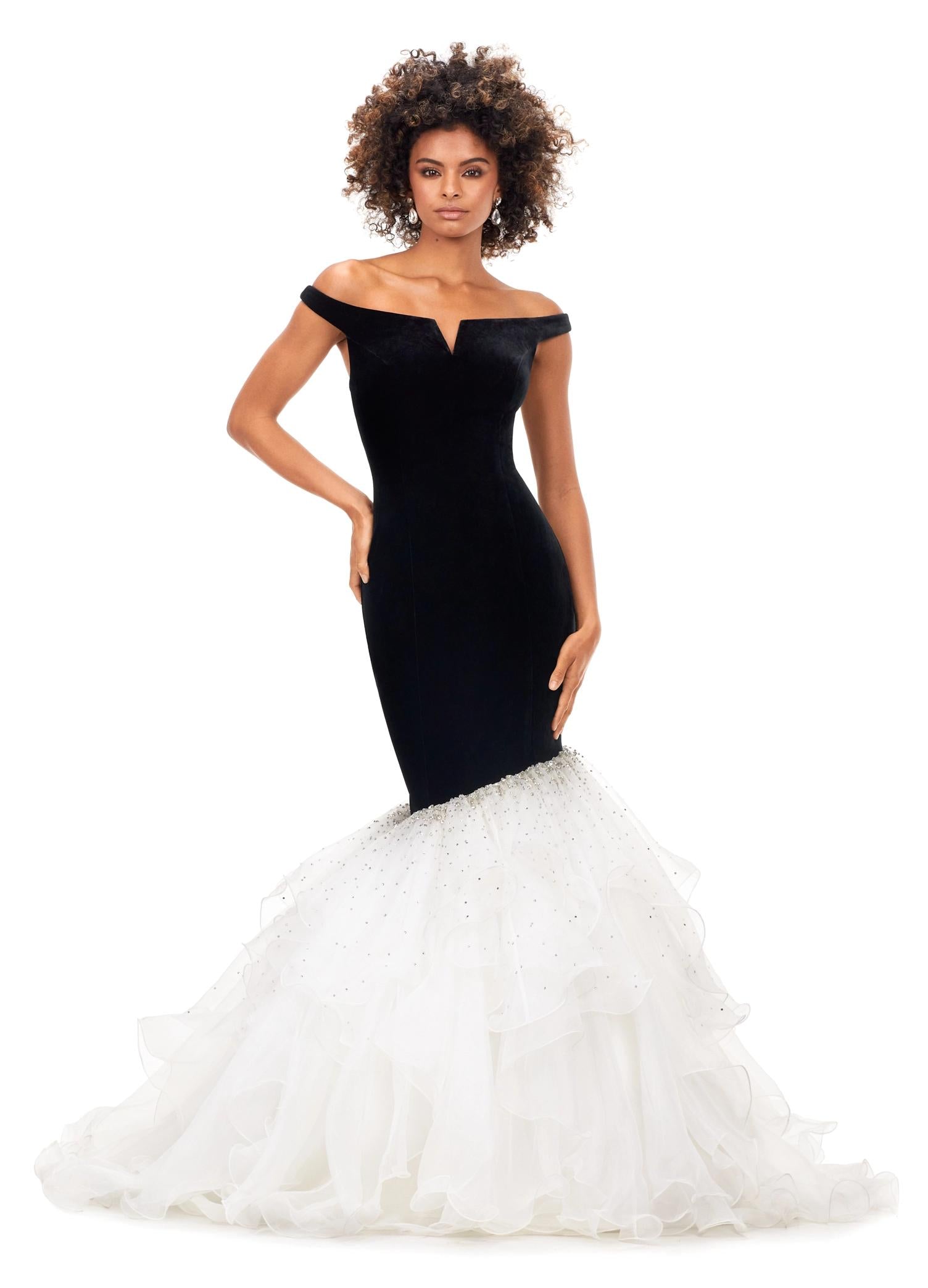 Black/Ivory ASHLEYlauren 11312 off shoulder velvet gown featuring a princess-seamed bodice, asymmetric organza ruffle fit and flare skirt, cascading crystal accents, and a sweep train for a dramatic and elegant look.