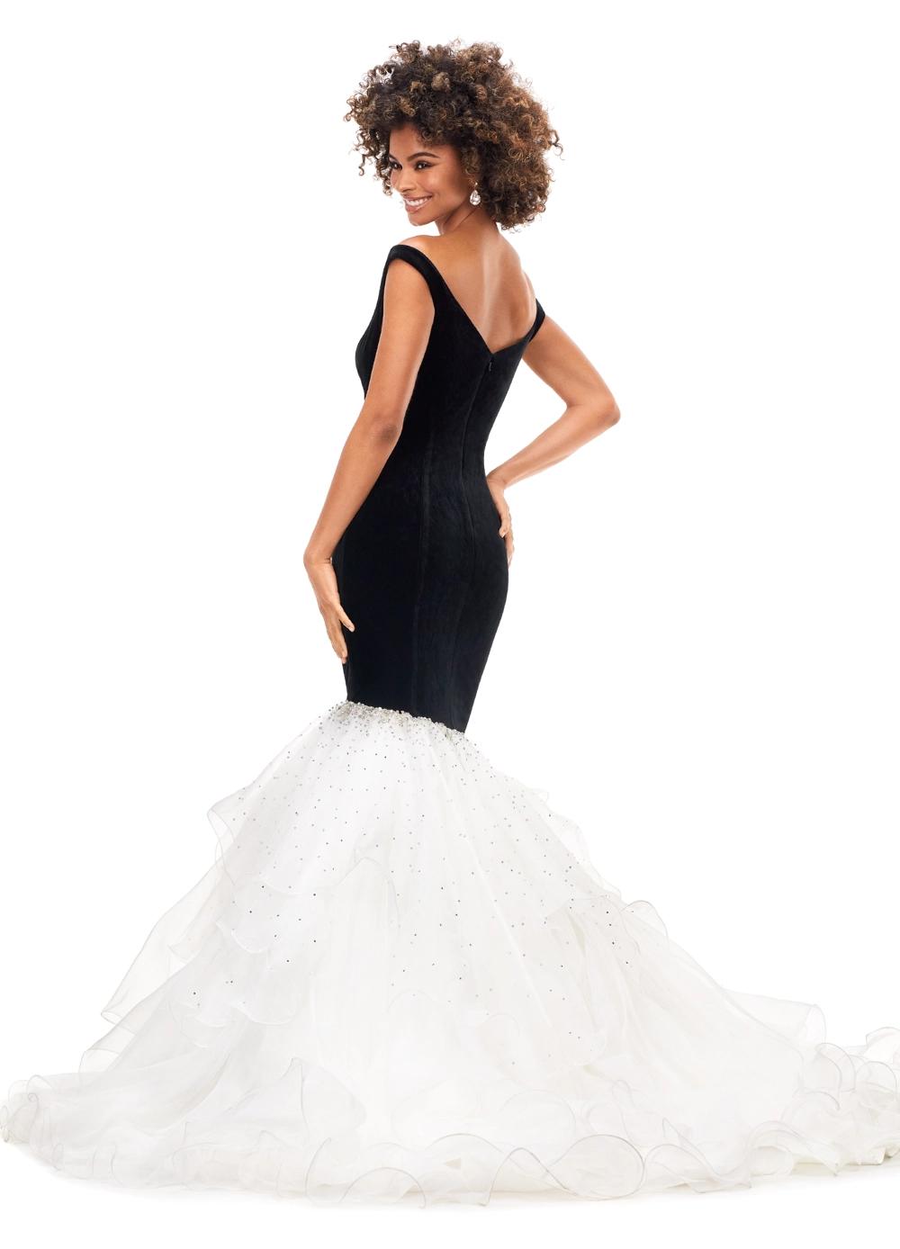 Back. Black/Ivory ASHLEYlauren 11312 off shoulder velvet gown featuring a princess-seamed bodice, asymmetric organza ruffle fit and flare skirt, cascading crystal accents, and a sweep train for a dramatic and elegant look.