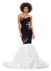 Black/White ASHLEYlauren 11232 elegant tulle gown featuring a ruched one shoulder bustier, scattered appliques, a fit & flare silhouette, and a glitter tulle mermaid ruffle skirt for a stunning and sophisticated look.