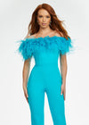 ASHLEYlauren 11100 – A flirty off-shoulder scuba jumpsuit featuring feather details along the neckline and flare pant legs. Perfect for making a stylish statement at your next event.