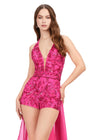 Close Up - Pink ASHLEYlauren 11386 halter romper featuring a deep V-neckline, open back, and a flowing chiffon overskirt for a chic and elegant look.