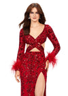 Close Up - Red ASHLEYlauren 11364 beaded gown featuring a V-neckline, crisscross cut-out bodice, long sleeves trimmed with feathers, left leg slit, and a sweep train for added drama.