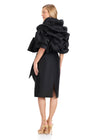 ASHLEYlauren E4916 | Black Mikado knee-length dress with oversized sculptural sleeves, wrap-effect bodice, and waist tie.