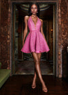 Editorial. Pink ASHLEYlauren 4677 fully crystal beaded cocktail dress featuring a deep V-neckline, halter design, open back, and a flirty A-line skirt for a glamorous and head-turning look.