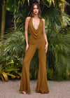 Editorial/Front. Bronze ASHLEYlauren 11775 standout jumpsuit featuring a halter neckline, illusion deep V-neckline adorned with crystal press-on stones, and a sleek silhouette for a bold and glamorous look.