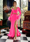 Hot Pink ASHLEYlauren 11308 striking scuba gown featuring a deep V-neckline, criss-cross cut out bodice, crystal waistline, long sleeves adorned with heat-set stones and feather trim, a fitted skirt, and a left leg slit for a bold and glamorous statement look.