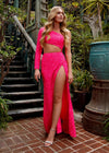 Editorial Pink ASHLEYlauren 11340 sequin one shoulder gown featuring a single sleeve, shark bite cut-out, wrap skirt, and left leg slit for a striking and glamorous look.