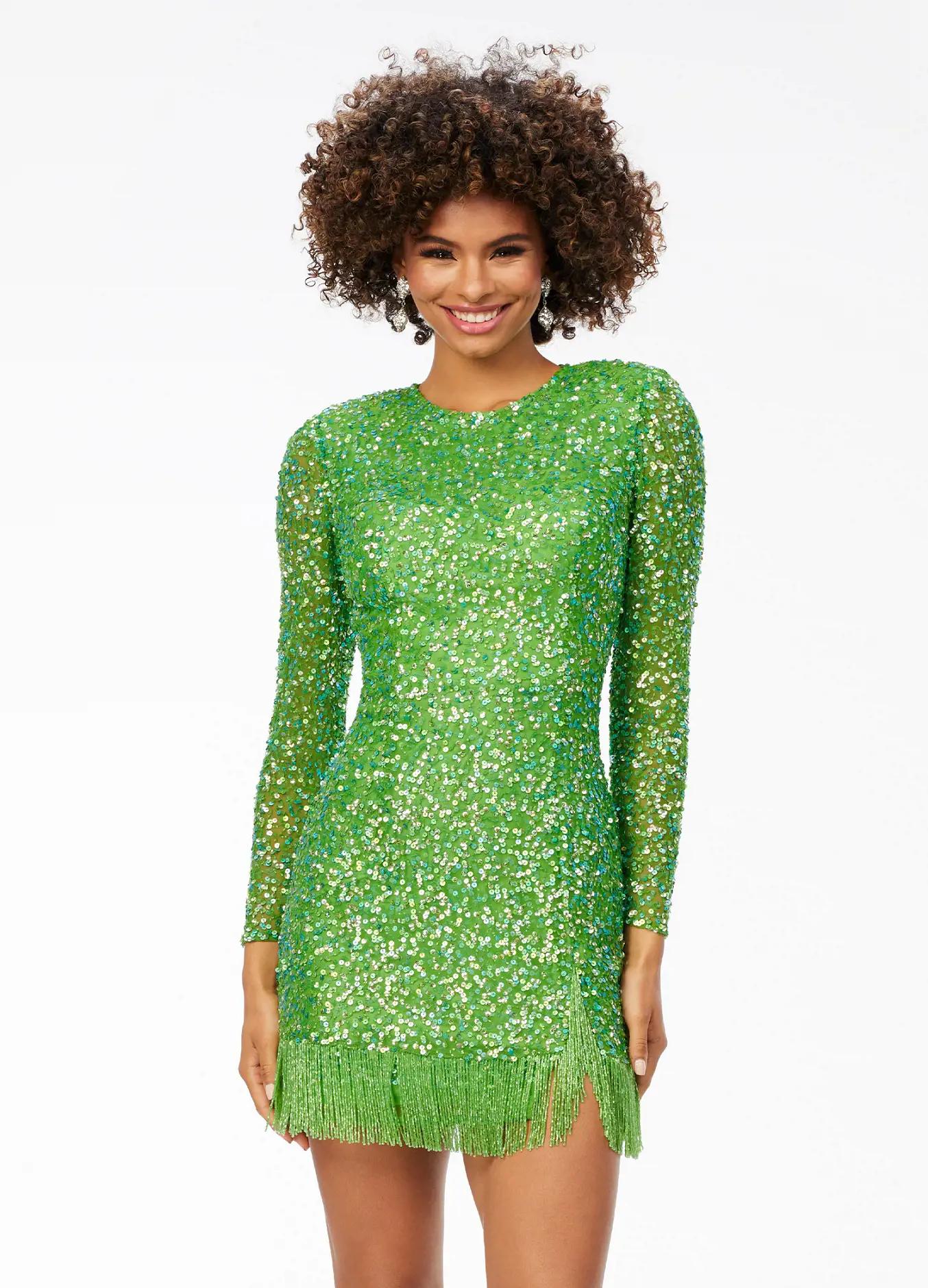 ASHLEYlauren 4438 – A sassy and classy fully hand-beaded long sleeve cocktail dress featuring a fitted skirt with fringe detail along the left leg slit and hemline. Perfect for making a bold, elegant statement at any event.