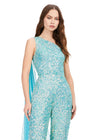 Front. Ab/Turquoise ASHLEYlauren 11384 eye-catching sequin jumpsuit featuring a one shoulder neckline, removable cape, open back with sequin straps, for a bold and glamorous statement look.