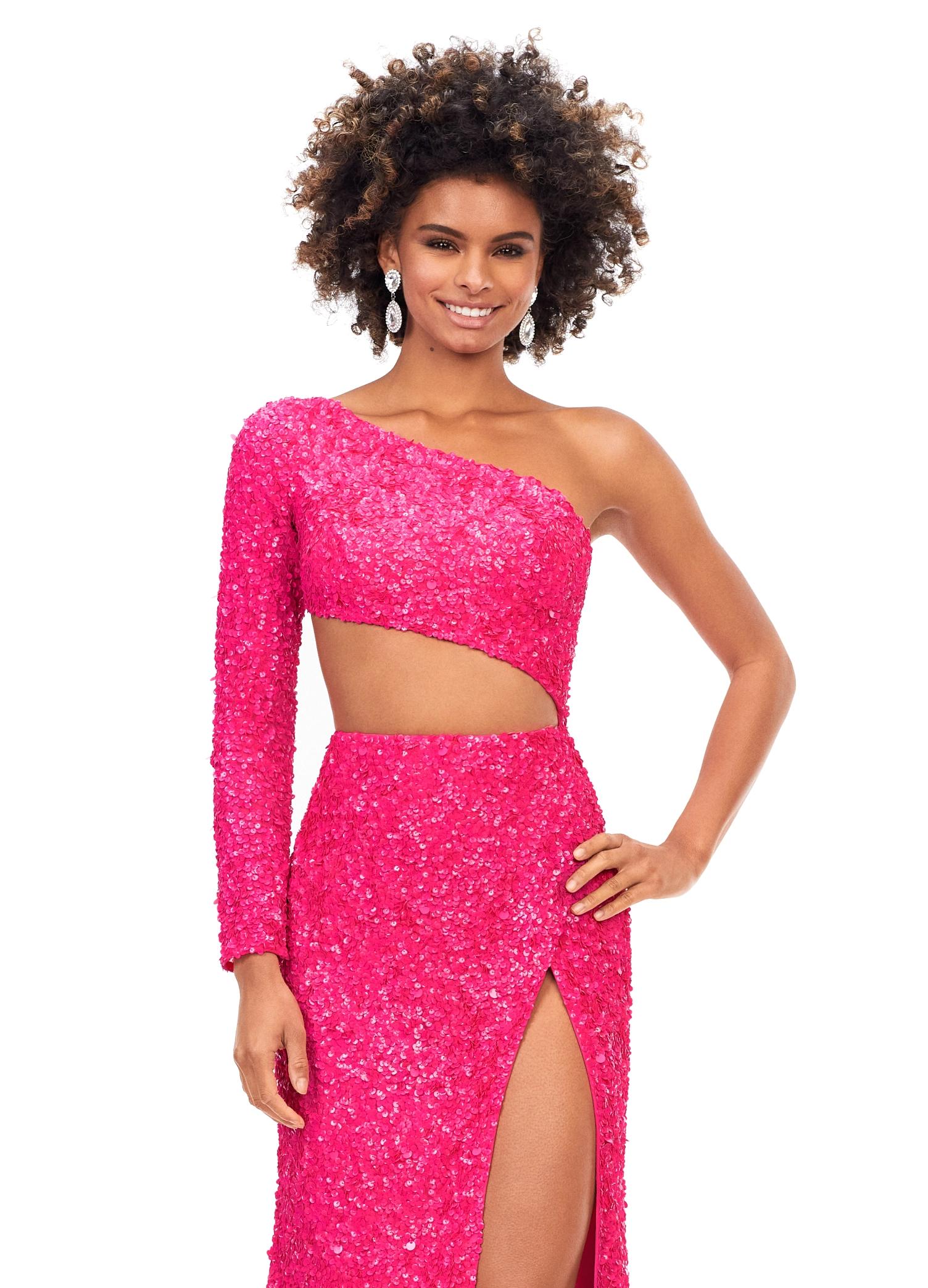 Front. Pink ASHLEYlauren 11340 sequin one shoulder gown featuring a single sleeve, shark bite cut-out, wrap skirt, and left leg slit for a striking and glamorous look.