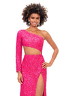 Front. Pink ASHLEYlauren 11340 sequin one shoulder gown featuring a single sleeve, shark bite cut-out, wrap skirt, and left leg slit for a striking and glamorous look.