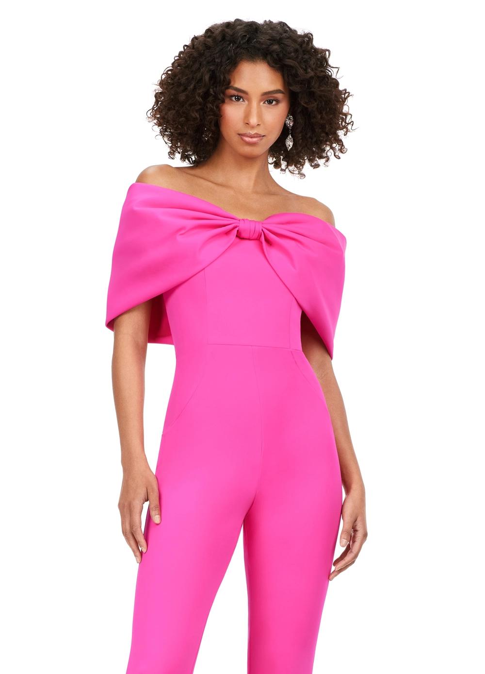 Front. Pink ASHLEYlauren 11414 chic scuba jumpsuit featuring an off shoulder neckline with an oversized bow for a bold and sophisticated statement look.