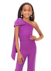 Front. Purple ASHLEYlauren Kids 8155 stylish one shoulder scuba jumpsuit featuring a statement bow with long tails on the shoulder and flare bell-bottom pants for a fun and fabulous look.
