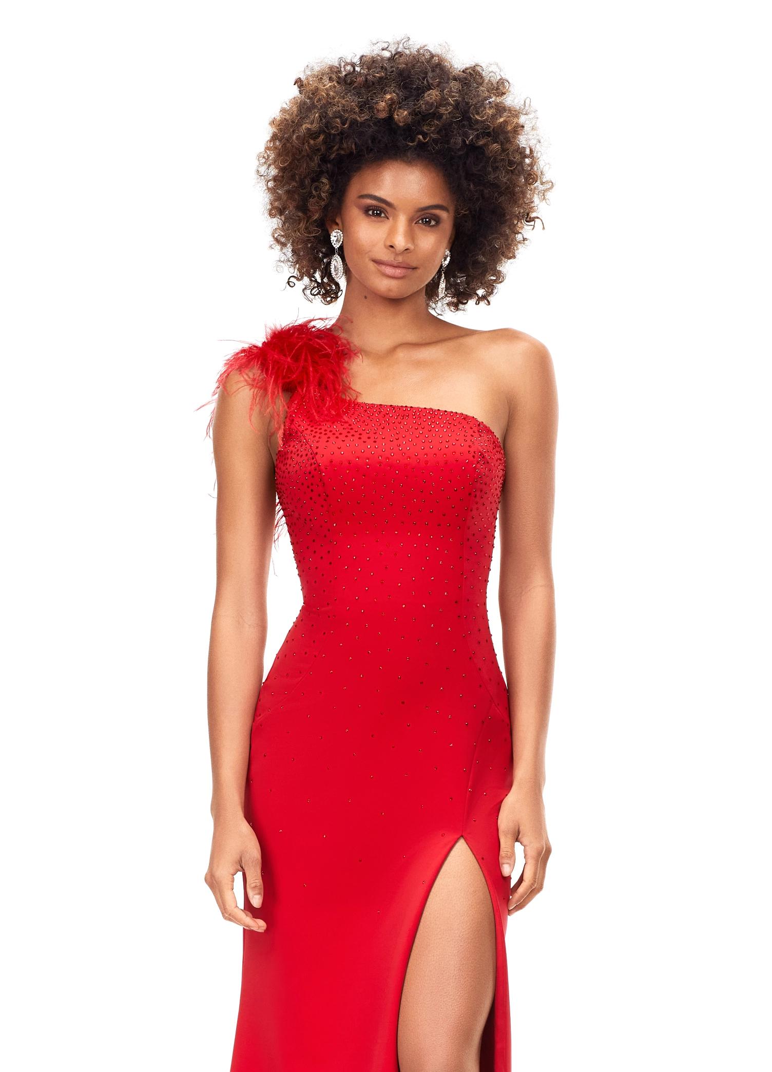 Front. Red ASHLEYlauren 1129 one shoulder scuba gown featuring feather-embellished neckline, heat set stones cascading down the skirt, and a left leg slit for a bold and elegant look.