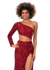 Front. Red ASHLEYlauren 11340 sequin one shoulder gown featuring a single sleeve, shark bite cut-out, wrap skirt, and left leg slit for a striking and glamorous look.
