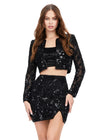 Front - Black ASHLEYlauren 4618 three piece set featuring a fully liquid beaded crop top, intricately beaded jacket, and a fitted skirt with a slit for a bold and fashionable statement look.