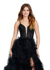 Front view. ASHLEYlauren 11446 black tulle gown with ruffled A-line skirt, corset bustier, deep illusion V-neckline, and leg slit