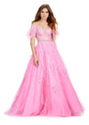 Front view. ASHLEYlauren 11447 pink A-line gown with beaded corset bustier, feather off shoulder straps, exposed boning, and lace appliqué