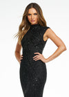 Front view. ASHLEYlauren 1674 Black fully beaded gown with high neck, cap sleeves, centre slit, and geometric detailing