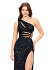 Front view. Black ASHLEYlauren 11288 stunning one shoulder fully hand-beaded gown featuring modern cut outs, criss cross waist straps, a left leg slit, and a sweep train for a bold and statement-making entrance.