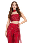 Front view. Red ASHLEYlauren 11385 statement two-piece jumpsuit featuring an intricately hand-beaded bustier and pants, a matching beaded choker, and a dramatic chiffon cape for a bold and fashion-forward look.