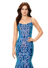 Front view. Turquoise/Royal ASHLEYlauren 11331 stunning velvet sequin gown featuring delicate spaghetti straps, a lace-up back for a perfect fit, intricately placed sequin appliques to complement your curves, and a sweep train for a glamorous and show-stopping entrance.