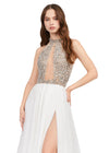 Ivory ASHLEYlauren 11248 – A stunning chiffon A-line gown featuring a beaded halter top with crystal details, an illusion cut-out, and a high left leg slit. Perfect for shining bright and making a statement at any special event.