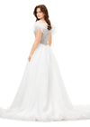 Back - Ivory ASHLEYlauren 11314 off shoulder gown featuring feather straps, a crystal-encrusted bustier, and a flowing organza A-line skirt with wire hem.