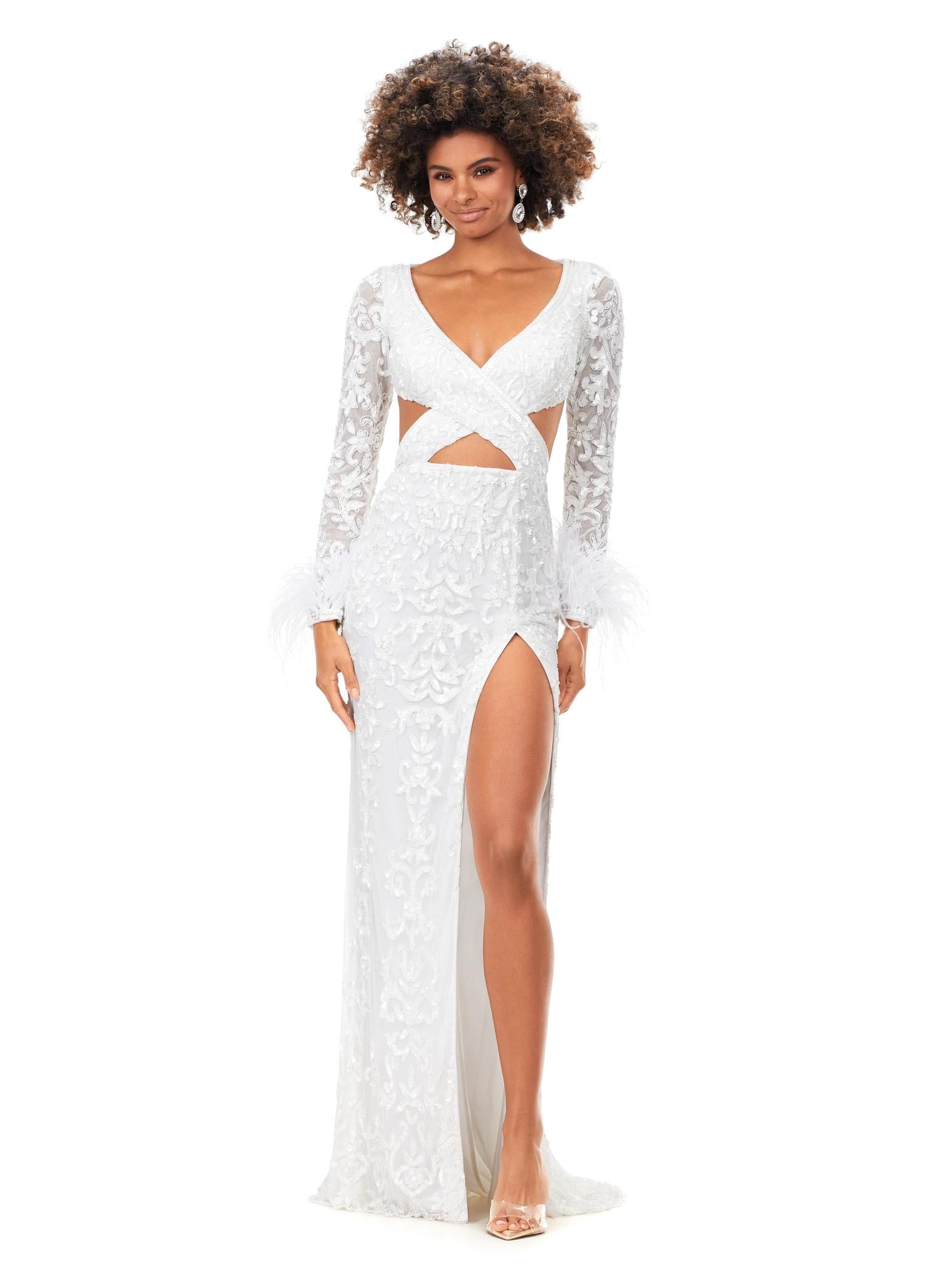 Ivory ASHLEYlauren 11364 beaded gown featuring a V-neckline, crisscross cut-out bodice, long sleeves trimmed with feathers, left leg slit, and a sweep train for added drama.