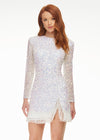 ASHLEYlauren 4438 – A sassy and classy fully hand-beaded long sleeve cocktail dress featuring a fitted skirt with fringe detail along the left leg slit and hemline. Perfect for making a bold, elegant statement at any event.