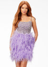 Lilac ASHLEYlauren 4537 cocktail dress featuring a fully encrusted crystal square neckline, spaghetti straps, lace-up back, fully beaded bustier, and a full feather skirt for a bold and glamorous look.