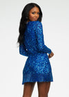ASHLEYlauren 4438 – A sassy and classy fully hand-beaded long sleeve cocktail dress featuring a fitted skirt with fringe detail along the left leg slit and hemline. Perfect for making a bold, elegant statement at any event.