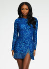 ASHLEYlauren 4438 – A sassy and classy fully hand-beaded long sleeve cocktail dress featuring a fitted skirt with fringe detail along the left leg slit and hemline. Perfect for making a bold, elegant statement at any event.