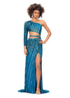 Peacock ASHLEYlauren 11261 fully hand-beaded one shoulder gown featuring a shark bite cut out at the waist, left leg slit, and intricately placed bead pattern to accentuate curves, complete with scattered fringe along the shoulder and waistline for a bold and glamorous look.