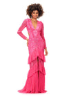 Pink ASHLEYlauren 11199 – A dramatic v-neck beaded gown featuring long sleeves, ruffle accents, a center slit, and a sweep train. Perfect for making a bold and elegant statement at any special event.