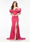 Pink ASHLEYlauren 11217 – A magnificent off-shoulder velvet gown featuring oversized ruffle details, a contour seamed skirt with a left leg slit, and a dramatic train. Perfect for making a bold, elegant statement at any event.