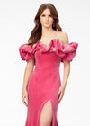 Pink ASHLEYlauren 11217 – A magnificent off-shoulder velvet gown featuring oversized ruffle details, a contour seamed skirt with a left leg slit, and a dramatic train. Perfect for making a bold, elegant statement at any event.