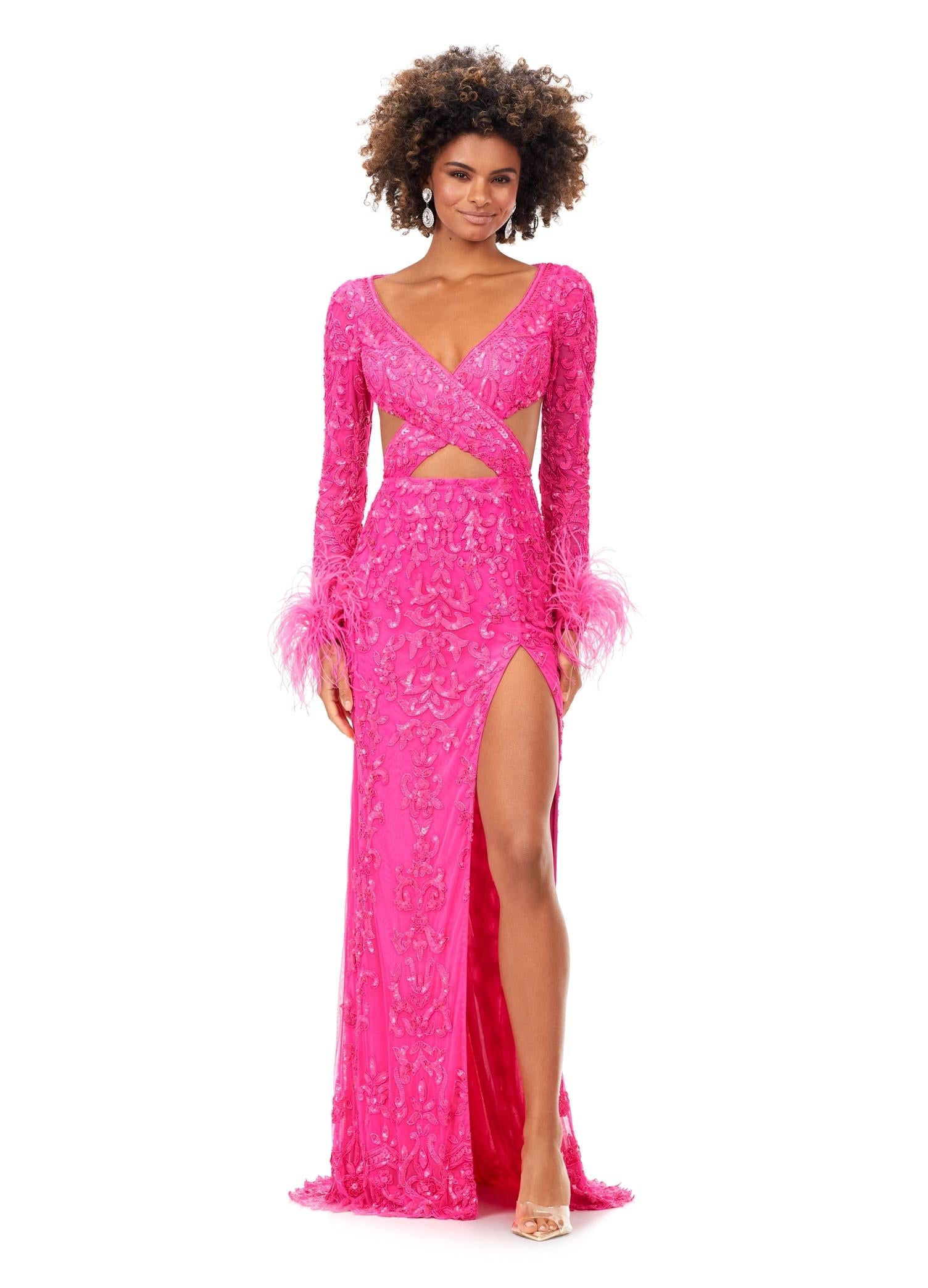 Pink ASHLEYlauren 11364 beaded gown featuring a V-neckline, crisscross cut-out bodice, long sleeves trimmed with feathers, left leg slit, and a sweep train for added drama.