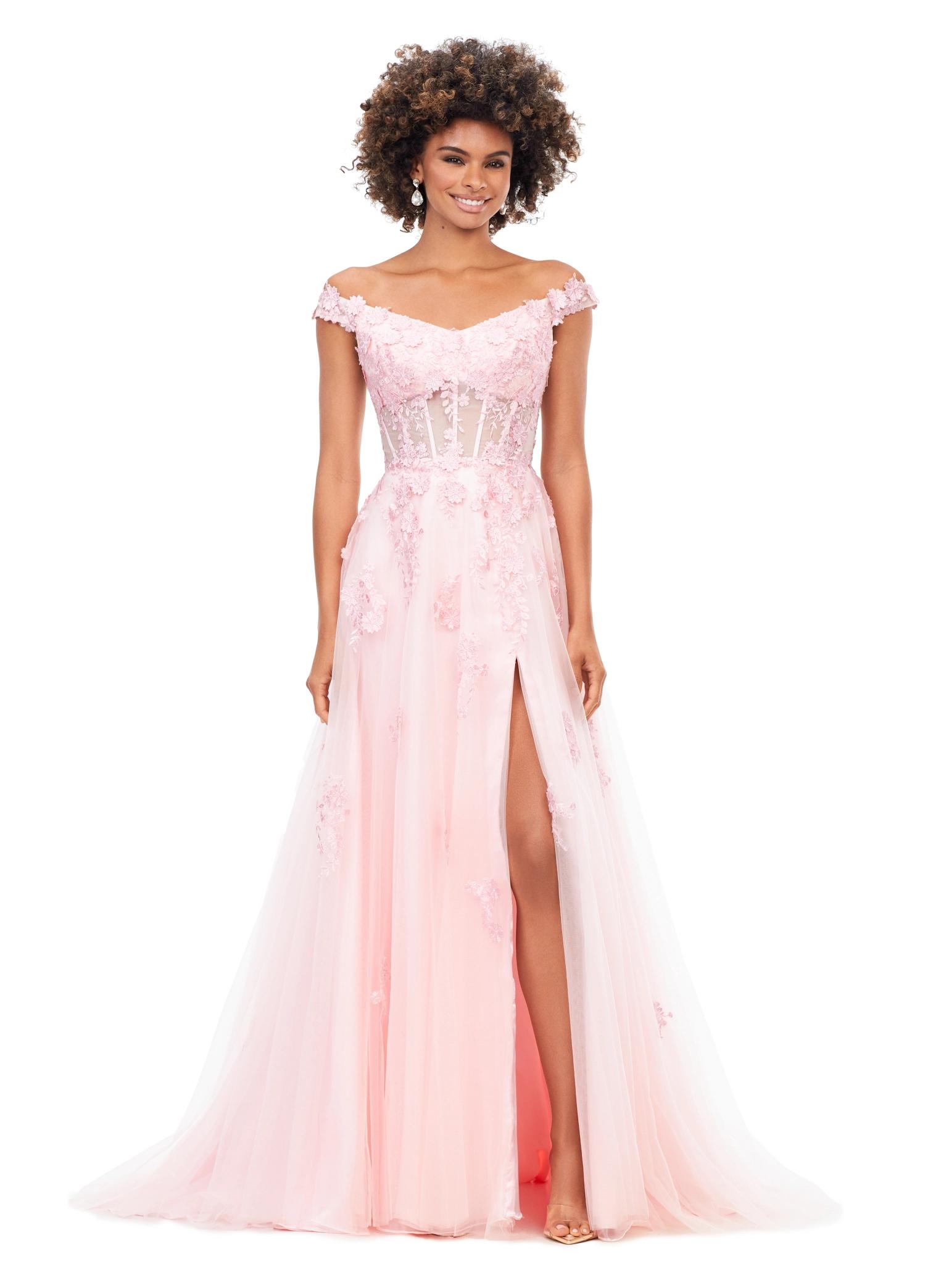 Pink ASHLEYlauren 11376 fairytale-inspired off-shoulder gown featuring an illusion corset bodice, delicate 3D lace flower appliques cascading throughout layers of tulle, and a left leg slit for an ethereal and romantic look.